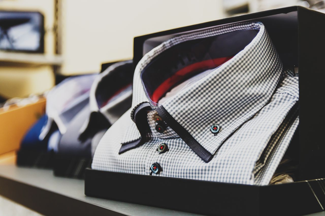 Contact Set of formal checkered shirts neatly packed in boxes, ideal for business or gift.