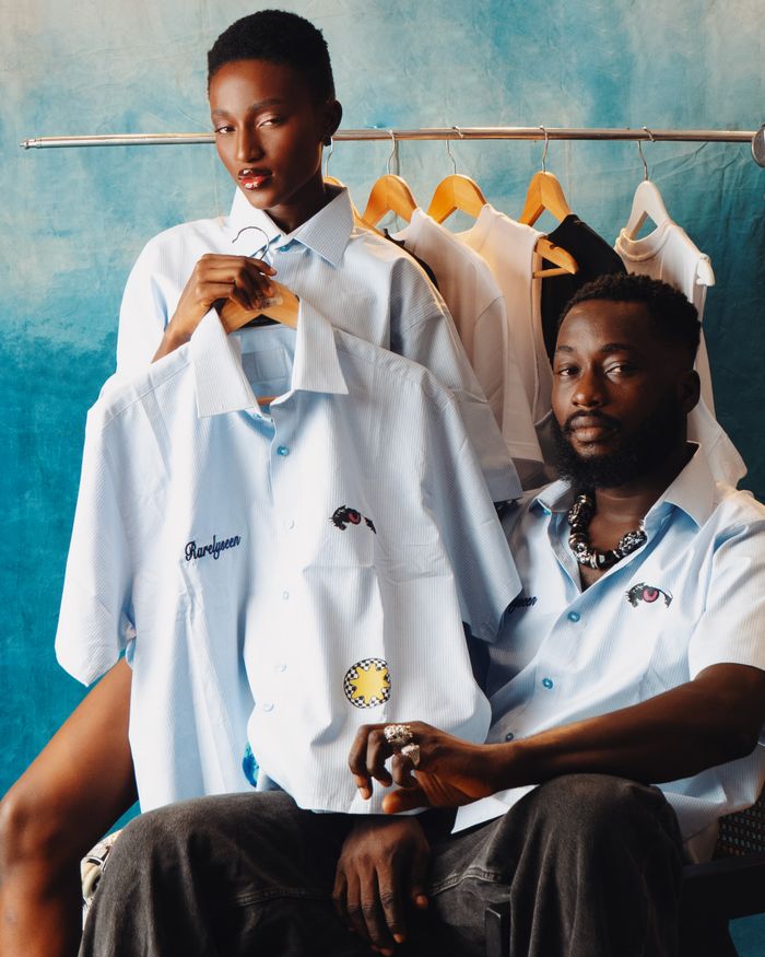 Home Fashionable portrait of two models showcasing custom embroidered shirts.